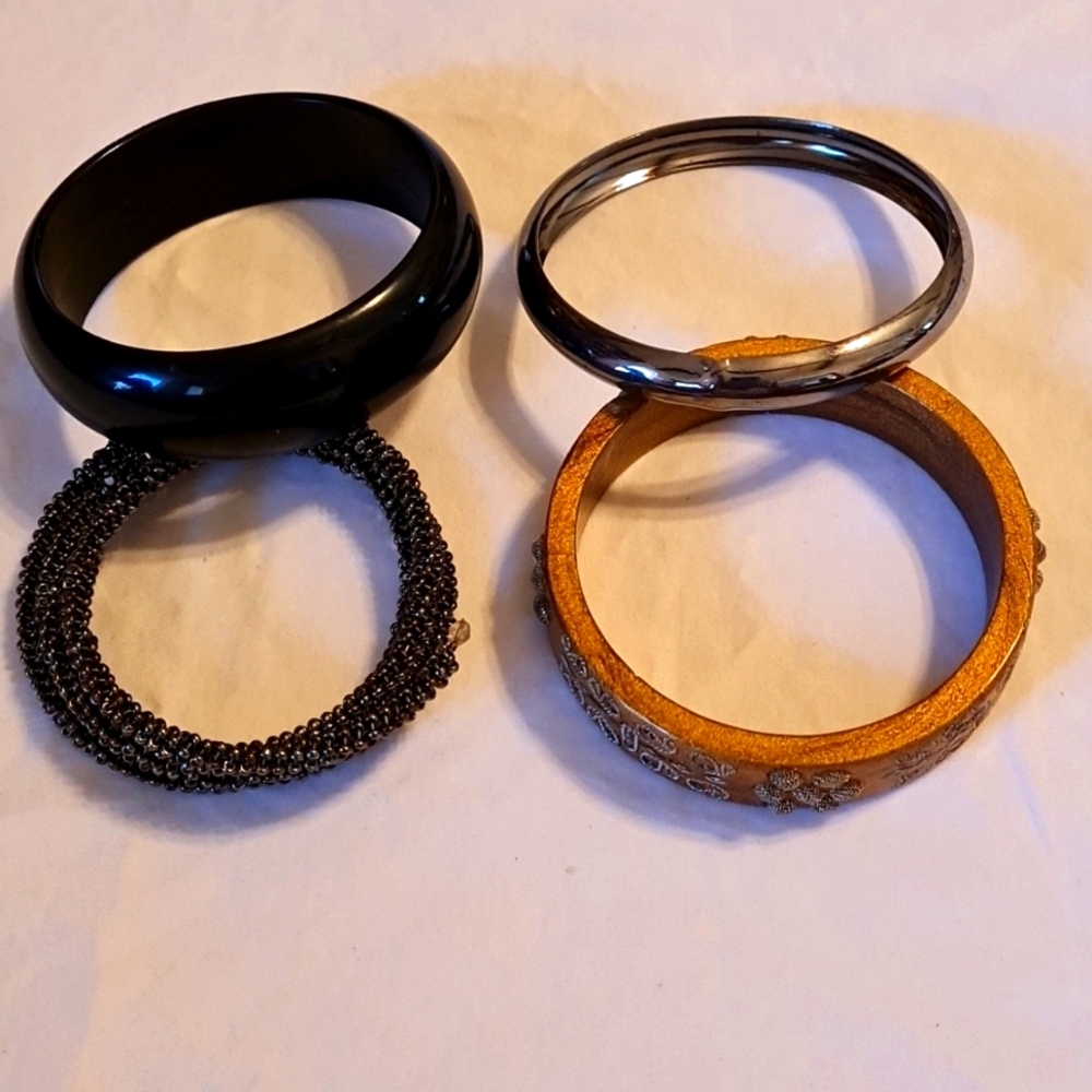 Bundle of 4 bracelets, 1 ring bracelet 2 cuff bracelets and 1 coil bracelet